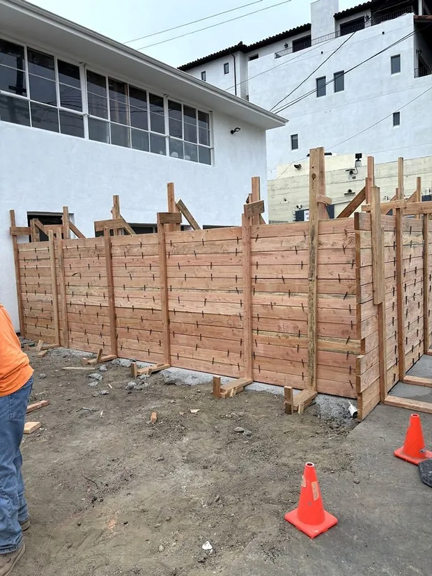 Braced timber formwork with snap ties standing ready to pour a concrete wall